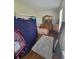 Bright bedroom features hardwood floors, natural light, and ample space at 58117 E 42Nd Dr, Strasburg, CO 80136