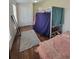 Bedroom with hardwood floors and bunkbeds at 58117 E 42Nd Dr, Strasburg, CO 80136