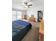Bedroom with ample storage, dresser, and natural light at 58117 E 42Nd Dr, Strasburg, CO 80136
