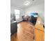 Functional bedroom featuring hardwood floors, natural light and a view at 58117 E 42Nd Dr, Strasburg, CO 80136