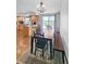 Bright dining area with natural light, hardwood floors, and seating for six at 58117 E 42Nd Dr, Strasburg, CO 80136