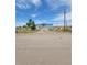 Charming single-story home featuring a covered front porch, attached garage, and spacious front yard at 58117 E 42Nd Dr, Strasburg, CO 80136