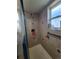 Updated tiled shower with modern fixtures and natural light at 58117 E 42Nd Dr, Strasburg, CO 80136