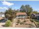 A cozy single-story home featuring a xeriscaped front yard, new roof and fenced backyard at 1568 S Osceola Way, Denver, CO 80219