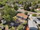 Aerial view of the property showcasing the house, backyard features, and surrounding neighborhood at 1568 S Osceola Way, Denver, CO 80219