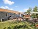 Expansive backyard featuring a deck, patio, garden, and shed for outdoor living and entertaining at 1568 S Osceola Way, Denver, CO 80219