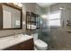 Updated bathroom with modern vanity, tiled shower, and sleek fixtures for a spa-like experience at 1568 S Osceola Way, Denver, CO 80219