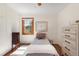 Cozy bedroom with hardwood floors, natural light, and neutral decor at 1568 S Osceola Way, Denver, CO 80219