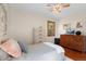 Cozy bedroom with hardwood floors, natural light, and neutral decor at 1568 S Osceola Way, Denver, CO 80219