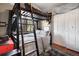 Cozy bedroom with bunkbeds, closet, and natural light that creates a relaxing space at 1568 S Osceola Way, Denver, CO 80219
