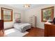 Cozy bedroom with hardwood floors, natural light, and neutral decor at 1568 S Osceola Way, Denver, CO 80219