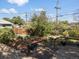 Established backyard garden area with raised beds, wooden pathway, and mature plantings at 1568 S Osceola Way, Denver, CO 80219