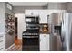 Kitchen featuring stainless steel appliances and sleek countertops at 1568 S Osceola Way, Denver, CO 80219