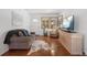 Cozy living room features hardwood floors, comfortable seating, and a well-lit ambiance at 1568 S Osceola Way, Denver, CO 80219