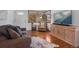 Inviting living room featuring hardwood floors, comfortable seating, and natural light at 1568 S Osceola Way, Denver, CO 80219