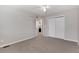 Spacious bedroom featuring a ceiling fan, closet, and ensuite bathroom entry at 12569 S Sopris Creek Dr, Parker, CO 80134
