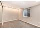 Cozy bedroom with neutral walls, carpet flooring, and a bright window at 12569 S Sopris Creek Dr, Parker, CO 80134