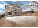 Exterior of home has a large backyard, patio and sliding glass door at 12569 S Sopris Creek Dr, Parker, CO 80134