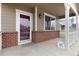 Charming front porch with brick accents and a view of the neighborhood at 12569 S Sopris Creek Dr, Parker, CO 80134