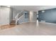 Open-concept living area with staircase, hardwood floors, and ample natural light at 12569 S Sopris Creek Dr, Parker, CO 80134