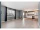 Open-concept living area with large windows, connecting to the kitchen with modern appliances at 12569 S Sopris Creek Dr, Parker, CO 80134