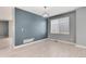 Open living area featuring hardwood floors, a modern chandelier, and plenty of natural light at 12569 S Sopris Creek Dr, Parker, CO 80134