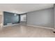 Spacious living room with natural light, modern flooring, and a stylish accent wall at 12569 S Sopris Creek Dr, Parker, CO 80134