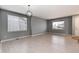 Bright living room with large windows, hardwood floors, and neutral wall paint at 12569 S Sopris Creek Dr, Parker, CO 80134
