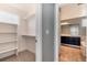 This closet features built-in shelving and hanging rods, maximizing storage space at 12569 S Sopris Creek Dr, Parker, CO 80134
