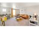 Comfortable living room with a large sectional sofa and playful decor at 13802 Quartz St, Mead, CO 80504
