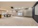 Spacious basement area featuring a pool table, projector screen and potential entertainment space at 22911 E Euclid Cir, Aurora, CO 80016