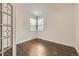 Bright, cozy room with hardwood floors and a decorative glass door at 22911 E Euclid Cir, Aurora, CO 80016