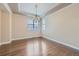Elegant dining room with hardwood floors, a chandelier, and windows at 22911 E Euclid Cir, Aurora, CO 80016