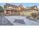 Beautiful two-story home featuring a three-car garage, manicured lawn and a cozy front porch at 22911 E Euclid Cir, Aurora, CO 80016