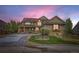 Charming two-story home with a well-manicured lawn, stone accents and a welcoming red front door at 22911 E Euclid Cir, Aurora, CO 80016