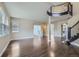 Spacious living room with hardwood floors, large windows, and an open floor plan for entertaining at 22911 E Euclid Cir, Aurora, CO 80016