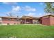 Backyard with covered patio area, spacious lawn, and privacy fence at 2792 S Stuart St, Denver, CO 80236