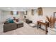 Relaxing finished basement with comfortable seating, large television, sewing machine, and storage space at 2792 S Stuart St, Denver, CO 80236