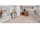 Spacious carpeted basement features an organized office space with desk, shelving, and decor at 2792 S Stuart St, Denver, CO 80236