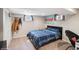Finished basement bedroom featuring neutral walls, carpeted floors, and natural light from two windows at 2792 S Stuart St, Denver, CO 80236