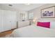 This is a bedroom that features a large comfortable bed, dresser and closet with wood floor at 2792 S Stuart St, Denver, CO 80236
