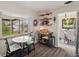 Charming breakfast nook with a small table, ample natural light, and decorative shelves with vintage accents at 2792 S Stuart St, Denver, CO 80236