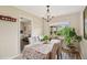 Elegant dining room with a large window, chandelier, and tastefully decorated table at 2792 S Stuart St, Denver, CO 80236