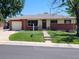 Charming single-story home featuring a brick facade, well-maintained lawn, and a welcoming front entrance at 2792 S Stuart St, Denver, CO 80236