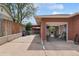 View of garage and driveway, featuring a spacious area for parking and storage at 2792 S Stuart St, Denver, CO 80236
