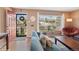Cozy living room with hardwood floors, large windows, and comfortable seating at 2792 S Stuart St, Denver, CO 80236