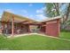 Spacious covered patio with outdoor dining table and view of the backyard at 2792 S Stuart St, Denver, CO 80236