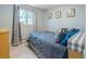 Bright bedroom with a large window and modern decor at 4647 W Dakota Ave, Denver, CO 80219