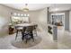 Bright dining area featuring unique windows, tile flooring and modern furnishings at 4647 W Dakota Ave, Denver, CO 80219