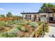 Charming home with a well-manicured front yard and mature landscaping at 4647 W Dakota Ave, Denver, CO 80219